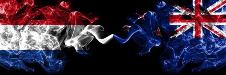 Netherlands vs New Zealand, Kiwi smoky mystic flags placed side by side. Thick colored silky abstract smoke flags.