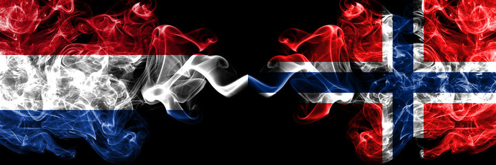 Netherlands vs Norway, Norwegian smoky mystic flags placed side by side. Thick colored silky abstract smoke flags.