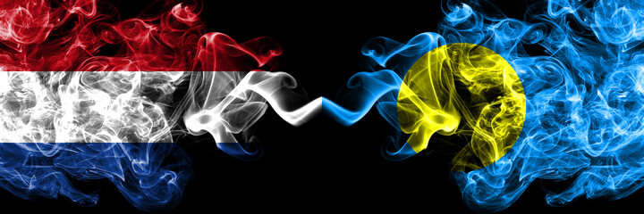 Netherlands vs Palau smoky mystic flags placed side by side. Thick colored silky abstract smoke flags.
