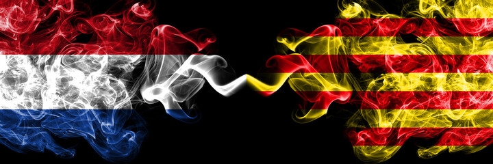 Netherlands vs Spain, Spanish, Catalonia, Senyera smoky mystic flags placed side by side. Thick colored silky abstract smoke flags.