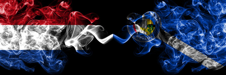Netherlands vs United States of America, America, US, USA, American, Las Vegas, Nevada smoky mystic flags placed side by side. Thick colored silky abstract smoke flags.