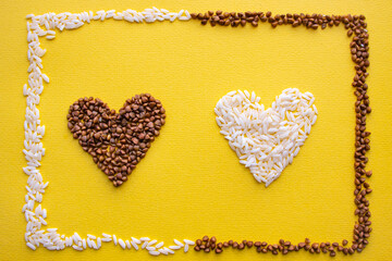Buckwheat and rice in the shape of a heart on a yellow background