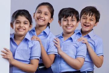 portrait of school children standing and smiling	
