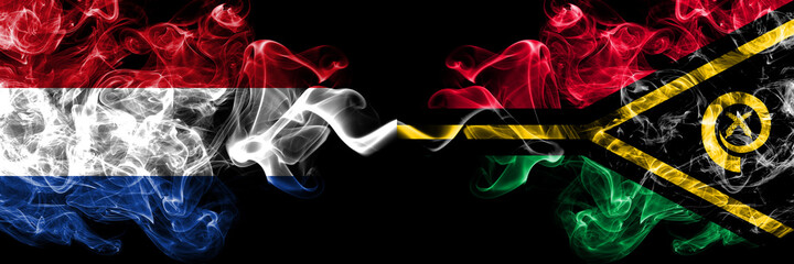 Netherlands vs Vanuatu smoky mystic flags placed side by side. Thick colored silky abstract smoke flags.