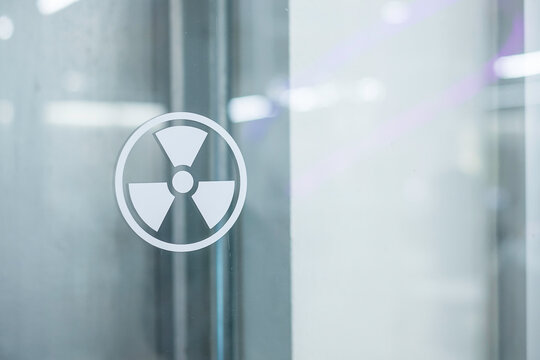 Radiation Zone Sign Sticker On Window Of Laboratory Room. Health And Safety Concept