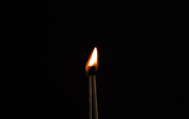 burning matches on black background