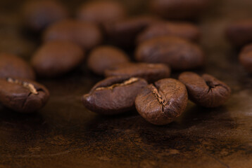 Coffee beans macro on brown background
