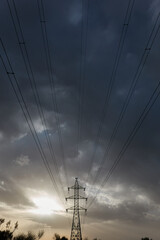 The last rays of the sun on some high voltage towers in Boadilla del Monte. Madrid's community. Spain