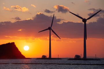 wind turbines at sunset