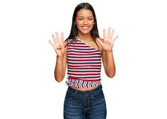 Beautiful hispanic woman wearing casual clothes showing and pointing up with fingers number nine...