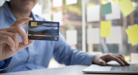 Online product purchase, Businessman use laptop register via credit cards to make online purchases, Shopping and mail, credit card online security, Online shopping concept.