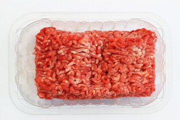  Fresh mince meat in transparent plastic box on white background 
