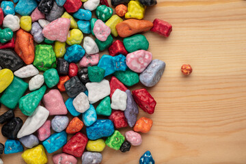 Colorful chocolate candy stones on white background