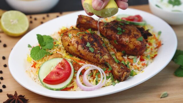 Chicken biryani Spicy Indian Malabar biryani Hyderabadi biryani, Dum Biriyani pulao 4K slow motion video footage Kerala India Sri Lanka basmati rice mixed rice dish with meat curry Ramadan Kareem, Eid
