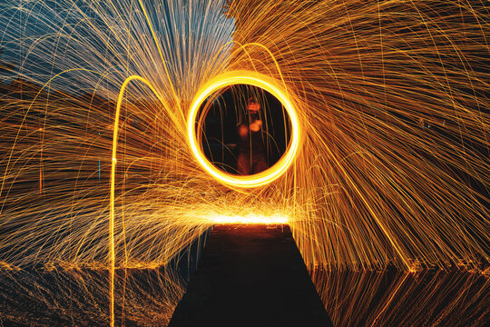 Person Spinning Wire Wool At Night