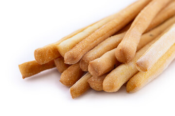 Gressini breadsticks made of wheat flour isoltaed on white background. Crispy bread from France