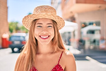 Young caucasian tourist girl smiling happy walking at the city.