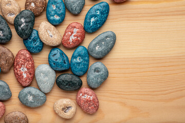 Colorful chocolate candy stones on white background