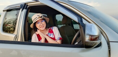 Teenage girl enjoy life in car of travel nature holiday.