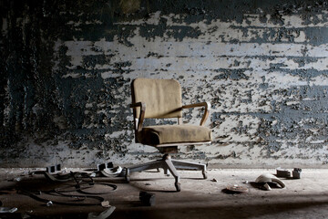 Fototapeta na wymiar Chair inside abandoned building