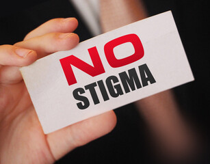 Business card expression say no stigma on businessman hand. Tolerance and equality business concept