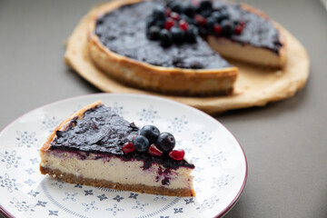 Blueberry vanilla cheesecake on a plain background