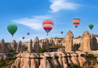 Colorful hot air balloons flying over Cappadocia in Love valley, Central Anatolia, Turkey. Nevsehir, Goreme National Park.