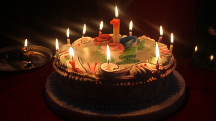 Fantastic shot of a wonderful white cake with colorful candles