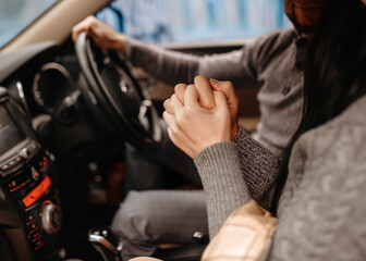 couple holding hands in car in cold season  