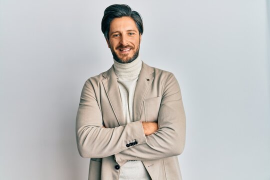 Young hispanic man with arms crossed gesture smiling with a happy and cool smile on face. showing teeth.