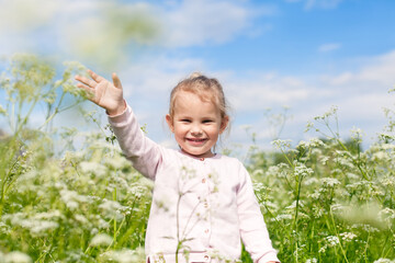 Happy child picking flower bouquet for mother on summer day. Kid outdoors in spring. Family vacation in the country. Education for toddler or preschool, childhood healthy lifestyle nature concept.