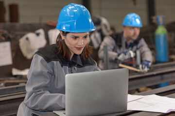 Concentrated woman worker on his industrial project