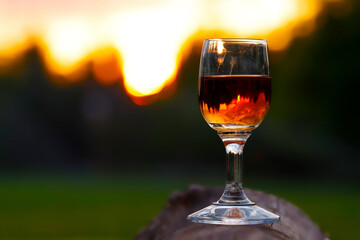 glass of cognac and sunset
