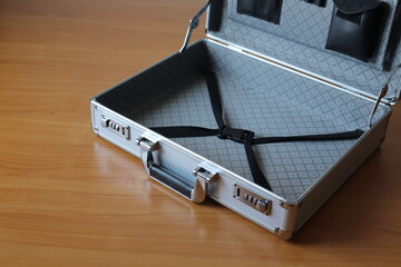 The secret briefcase is placed on the desk to hide information when moving documents or not wanting to disclose the secret layer.