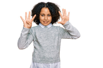 Young little girl with afro hair wearing casual clothes showing and pointing up with fingers number...