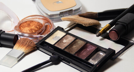 remnants of various cosmetics, dirty makeup brushes and sponges, mess in the makeup bag, unsanitary conditions