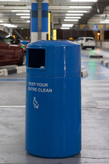 Blue Trash Can in the Parking aerie
