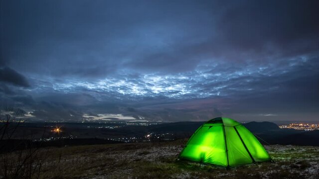 Tent in the evening in winter on the mountain, timelapse