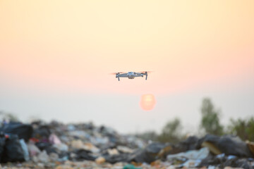 Fototapeta na wymiar Flying drone pilots take pictures of the garbage pile. To explore the garbage