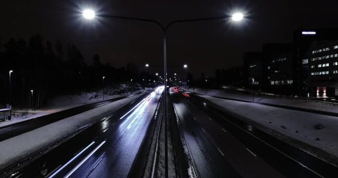 Time-lapse of the highway traffic in the winter night in Espoo, Finland.