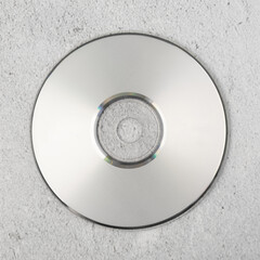 Realistic white cd template on white cement background.