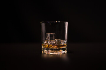 Closeup Barman pouring whiskey into glass