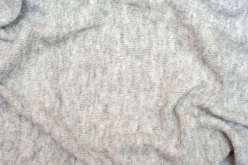 Knitted gray background. Textures for backgrounds. 