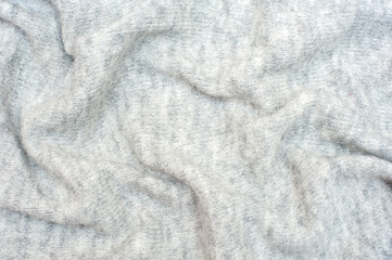Naklejka premium Knitted gray background. Textures for backgrounds. 