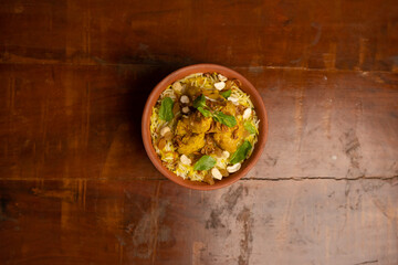 Fototapeta na wymiar Delicious spicy chicken biryani , Indian or Pakistani ramzan food. on smoky background.