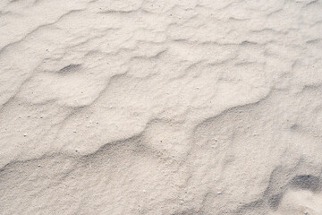 Detail of texture sand in tropical island Summer background and travel design
