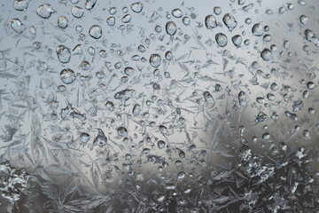 Icy flowers-glass blur of frozen window