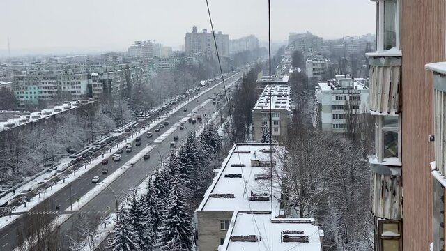 Aerial top view of a city road with traffic in Chisinau, Moldova in winter