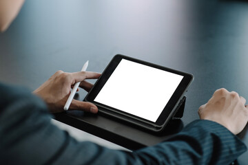 Close up. Businessman using digital tablet blank white screen.