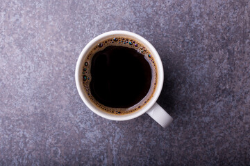 white cup full of hot coffee from french press